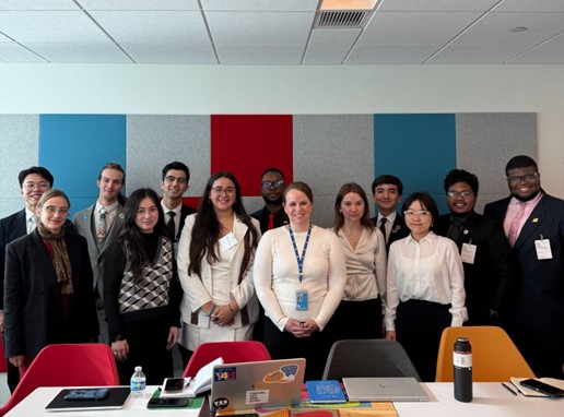 Group photo with Ms. Katherine Prizeman, Political Affairs Officer, after her briefing on the First Committee